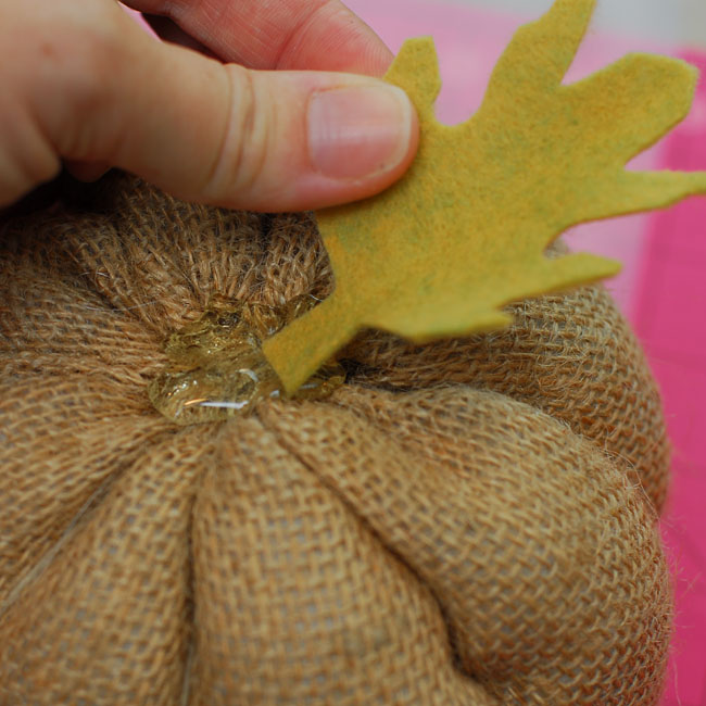22 - Create a pool of hot glue and place first the leaf then the end of the stem into the glue - Keri Lee Sereika